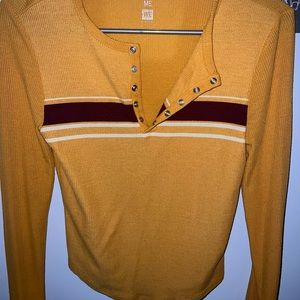 Yellow plain with some strips, long sleeve.